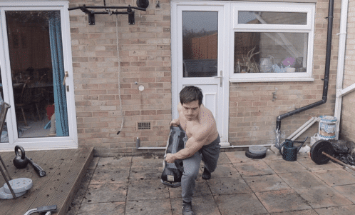 Sandbag Twisting Lunge