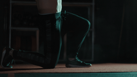 Half kneeling slam