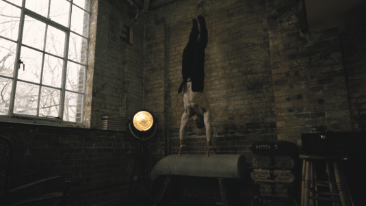 Red Hood Handstand