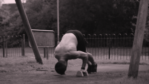 Pike Push Up on Parallettes